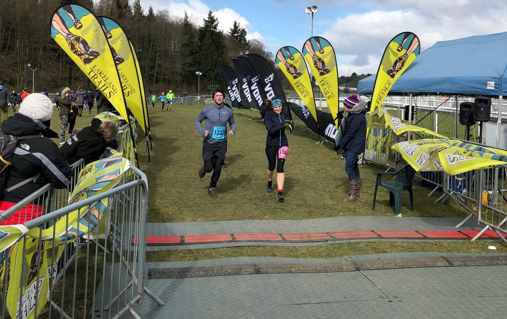 Briony crossing the finish line on the Cartmel 5km