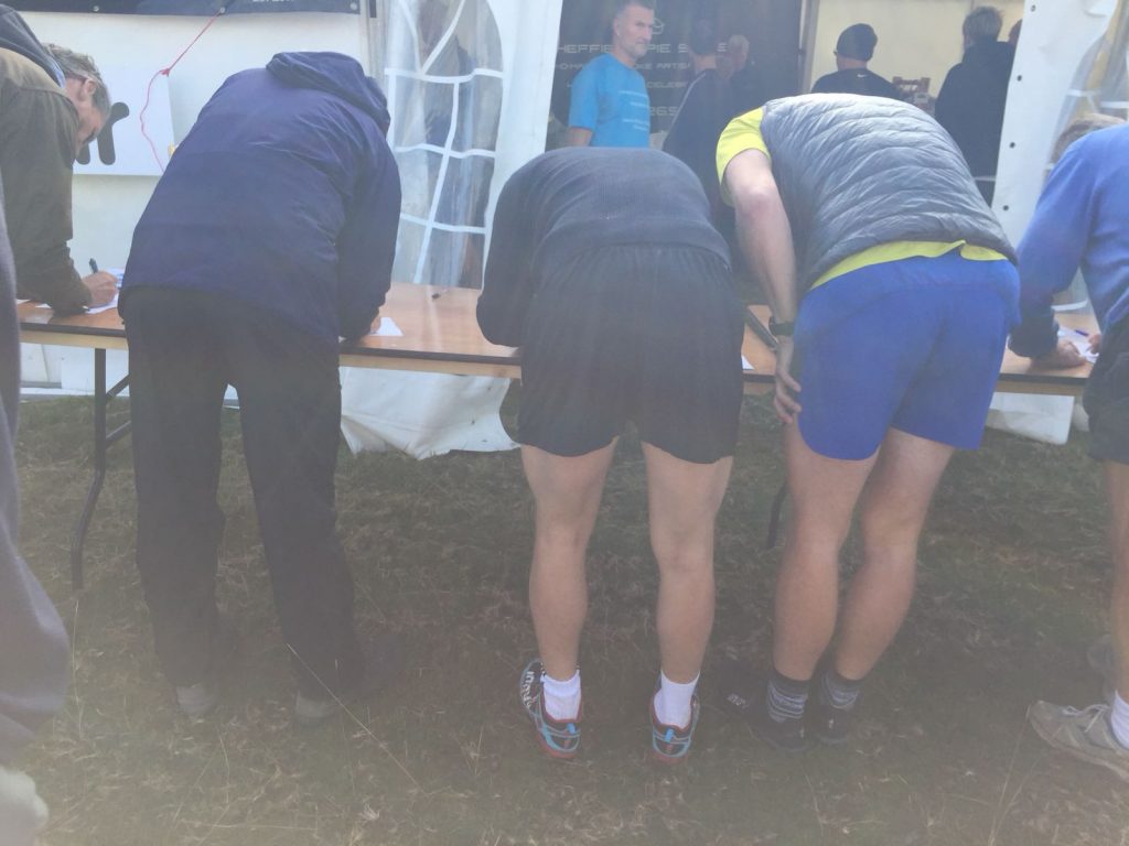 Collecting out numbers at Longshaw Fell Race
